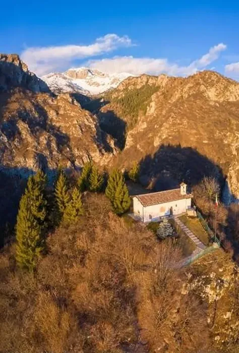Framed Print : Aerial view of the small church called San Peder and the Presolana during a winter sunset Framed Print : Aerial view of the small church called San Peder and the Presolana during a winter sunset