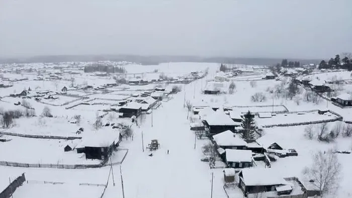 Framed Print : Aerial view of snow covered roofs of wooden houses. Clip. Small winter village on a heavy cloudy sky background Framed Print : Aerial view of snow covered roofs of wooden houses. Clip. Small winter village on a heavy cloudy sky background