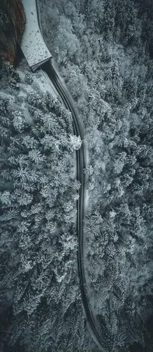 Framed Print : Aerial view of snowy forest with a road. Captured from above with a drone Framed Print : Aerial view of snowy forest with a road. Captured from above with a drone