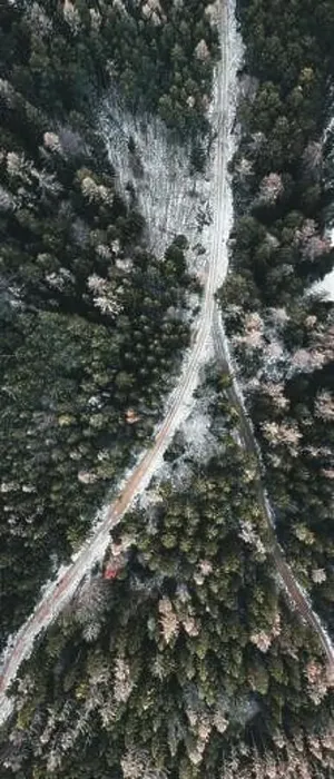 Framed Print : Aerial view of snowy winter forest with a road in austria Framed Print : Aerial view of snowy winter forest with a road in austria