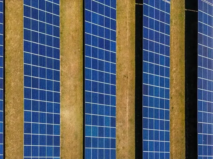 Framed Print : Aerial view of solar modules of a ground-mounted photovoltaic system on a field as a top view from above