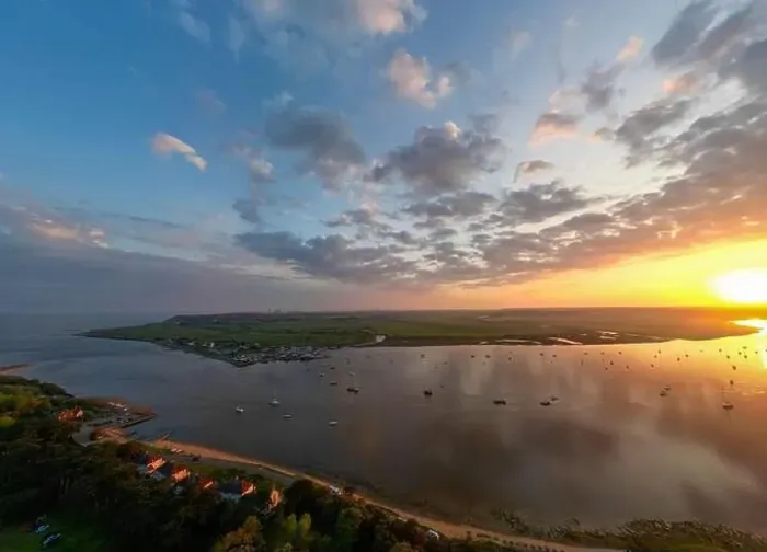 Framed Print : An aerial view of a spectacular sunset over the River Deben at Bawdsey Beach in Suffolk, UK