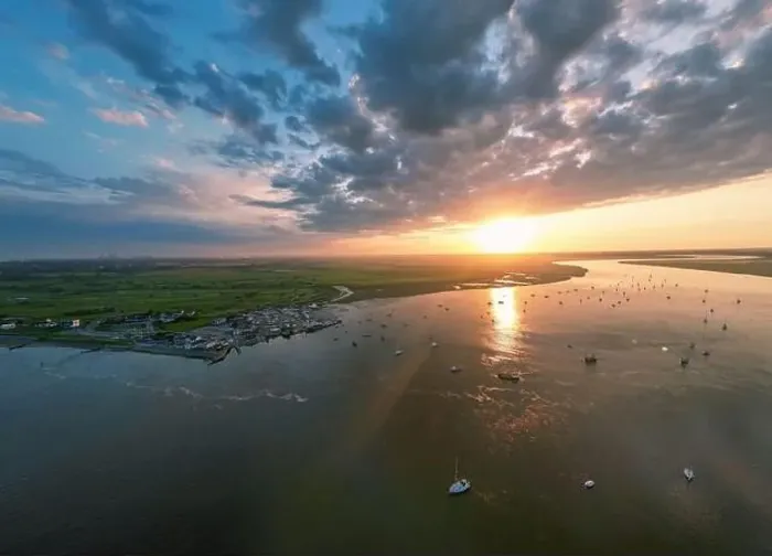 Framed Print : An aerial view of a spectacular sunset over the River Deben at Bawdsey Beach in Suffolk, UK Framed Print : An aerial view of a spectacular sunset over the River Deben at Bawdsey Beach in Suffolk, UK