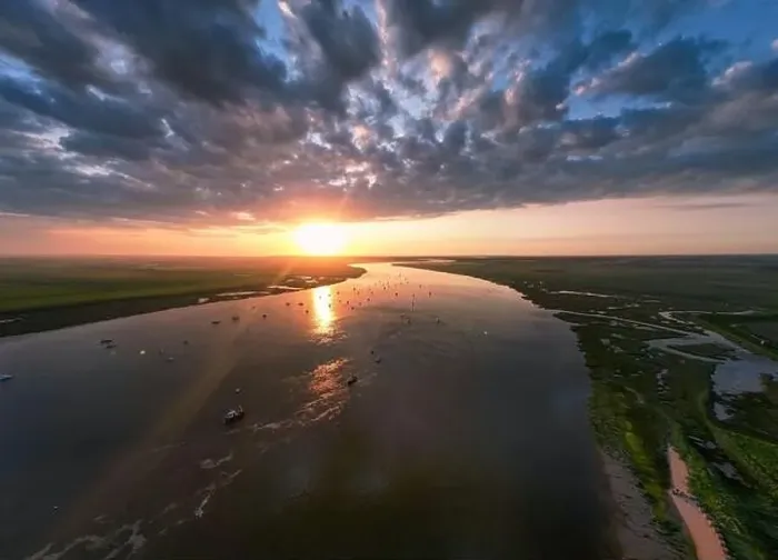 Framed Print : An aerial view of a spectacular sunset over the River Deben at Bawdsey Beach in Suffolk, UK Framed Print : An aerial view of a spectacular sunset over the River Deben at Bawdsey Beach in Suffolk, UK