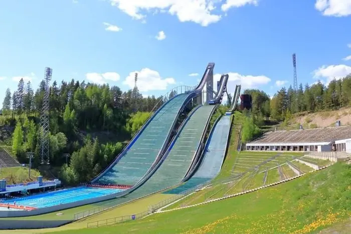Framed Print : Aerial view of sports centre with three ski jump towers in the summer, Lahti in Finland Framed Print : Aerial view of sports centre with three ski jump towers in the summer, Lahti in Finland
