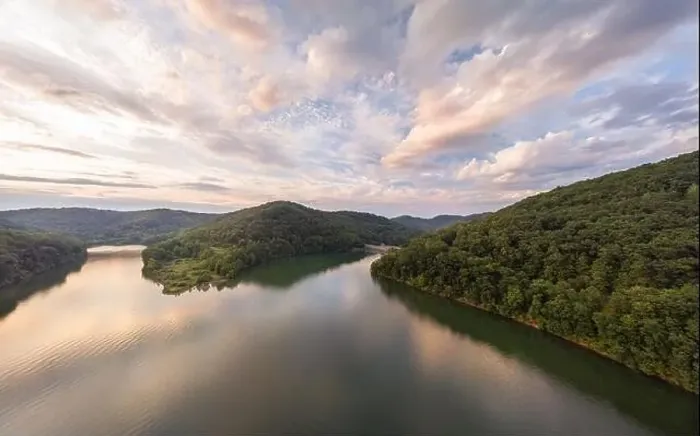 Framed Print : An aerial view of Stonewall Jackson Lake and the dam in the distant foreground with clouds overhead at sunset Framed Print : An aerial view of Stonewall Jackson Lake and the dam in the distant foreground with clouds overhead at sunset