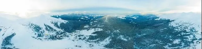 Framed Print : Aerial view of the stunning winter panorama of the snowy slopes and hills among the lush white clouds Framed Print : Aerial view of the stunning winter panorama of the snowy slopes and hills among the lush white clouds