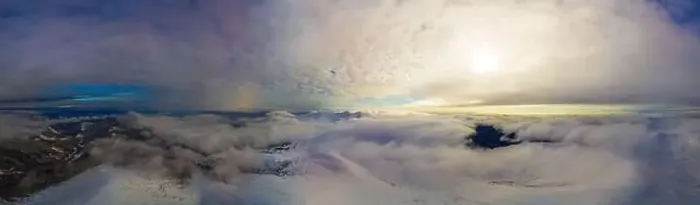 Framed Print : Aerial view of the stunning winter panorama of the snowy slopes and hills among the lush white clouds Framed Print : Aerial view of the stunning winter panorama of the snowy slopes and hills among the lush white clouds