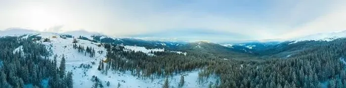 Framed Print : Aerial view of the stunning winter panorama of the snowy slopes and hills among the lush white clouds Framed Print : Aerial view of the stunning winter panorama of the snowy slopes and hills among the lush white clouds
