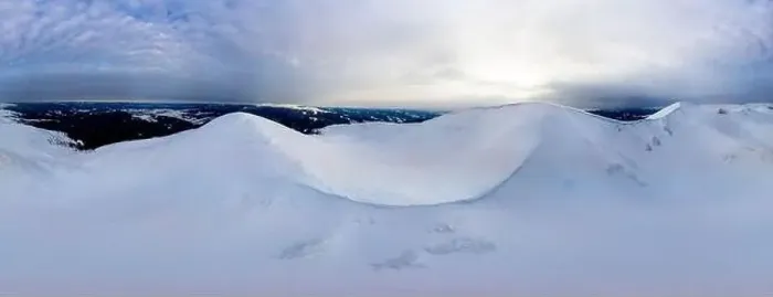 Framed Print : Aerial view of the stunning winter panorama of the snowy slopes and hills among the lush white clouds Framed Print : Aerial view of the stunning winter panorama of the snowy slopes and hills among the lush white clouds