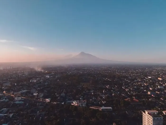 Framed Print : Aerial view of sunset Mount Merapi and Yogyakarta city, Indonesia. City with mountain background view Framed Print : Aerial view of sunset Mount Merapi and Yogyakarta city, Indonesia. City with mountain background view