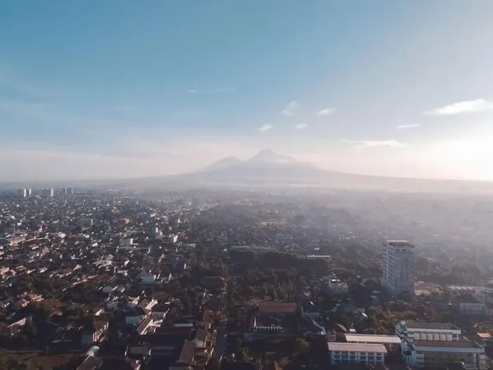 Framed Print : Aerial view of sunset Mount Merapi and Yogyakarta city, Indonesia. City with mountain background view Framed Print : Aerial view of sunset Mount Merapi and Yogyakarta city, Indonesia. City with mountain background view