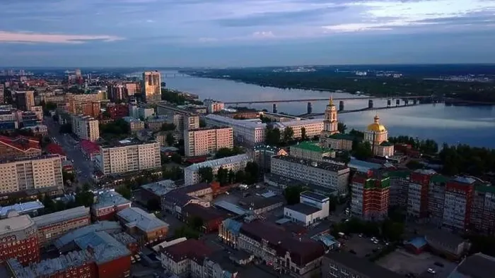 Framed Print : Aerial view of the sunset sky above the wide river. Clip. Green town located along the river Framed Print : Aerial view of the sunset sky above the wide river. Clip. Green town located along the river