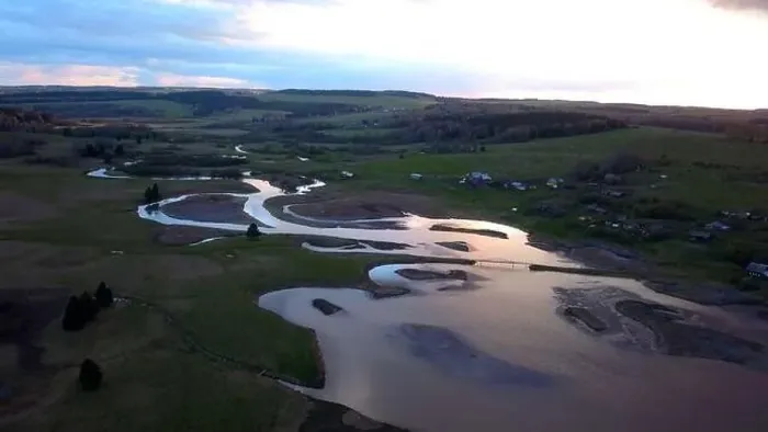 Framed Print : Aerial view of a swampy terrain on a sunset sky background. Clip. Bending river and fields Framed Print : Aerial view of a swampy terrain on a sunset sky background. Clip. Bending river and fields