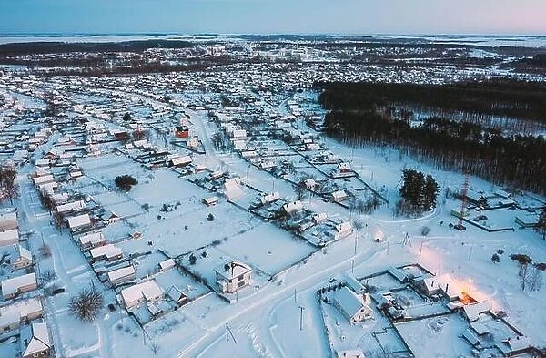 Aerial View Of Town Skyline Winter Evening Night. Snowy Landscape Cityscape Skyline