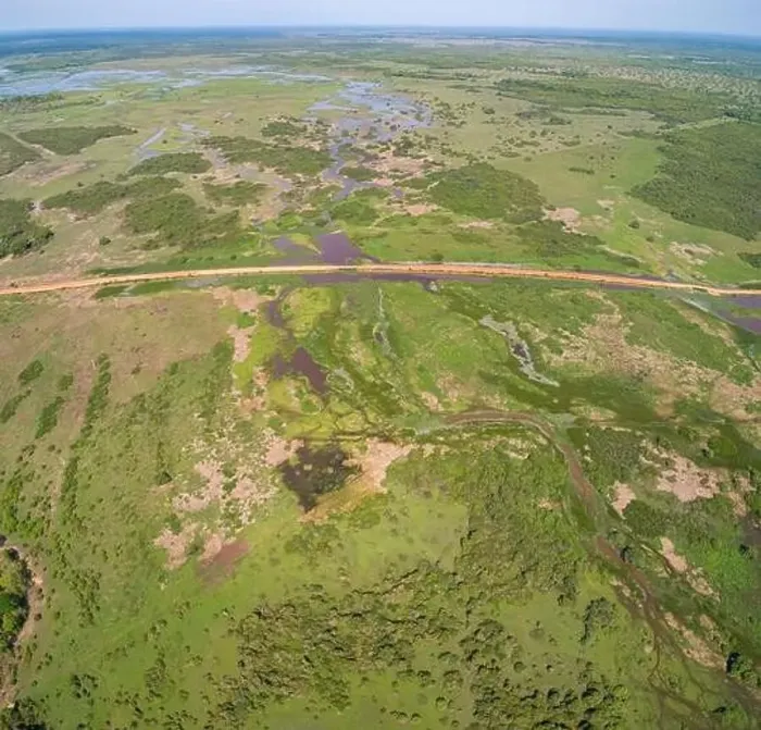 Framed Print : Aerial view of Transpantaneira dirt road crossing a lagoon over a small bridge in the typical landscape of North Framed Print : Aerial view of Transpantaneira dirt road crossing a lagoon over a small bridge in the typical landscape of North