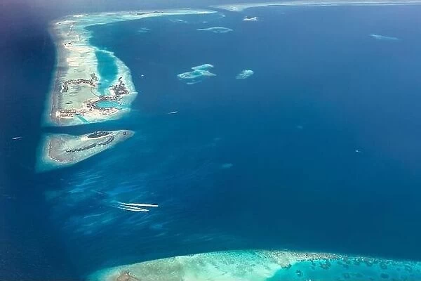Aerial view on tropical islands. Aerial photo of beautiful paradise Maldives tropical beach on island. Summer and travel vacation concept