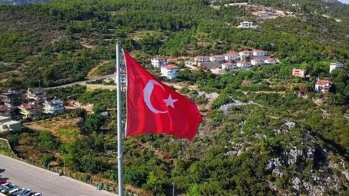 Framed Print : Aerial view of a Turkey national red flag. Clip. Summer green mountain and vegetation with buildings Framed Print : Aerial view of a Turkey national red flag. Clip. Summer green mountain and vegetation with buildings