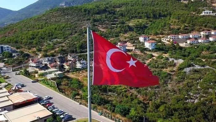Framed Print : Aerial view of a Turkey national red flag. Clip. Summer green mountain and vegetation with buildings Framed Print : Aerial view of a Turkey national red flag. Clip. Summer green mountain and vegetation with buildings