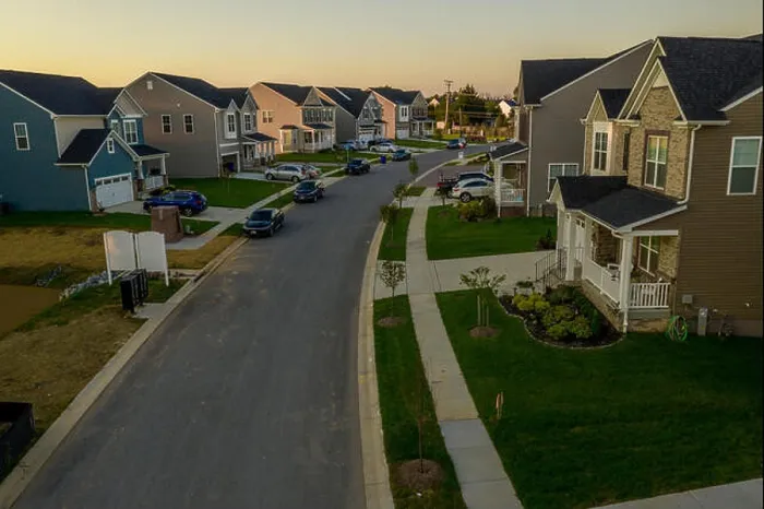 Framed Print : Aerial view of typical American new construction neighborhood street in Maryland for the upper middle class Framed Print : Aerial view of typical American new construction neighborhood street in Maryland for the upper middle class