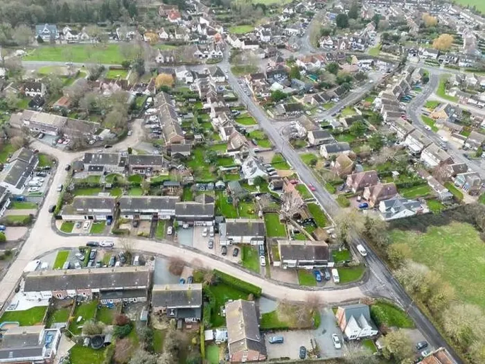 Framed Print : Aerial view of a typical English village showing housing development expansion over the years Framed Print : Aerial view of a typical English village showing housing development expansion over the years