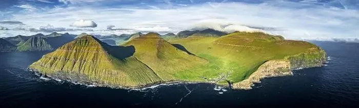 Framed Print : Aerial view of the village of Gjogv on cliffs overlooking the Atlantic Ocean, Eysturoy Island, Faroe Islands Framed Print : Aerial view of the village of Gjogv on cliffs overlooking the Atlantic Ocean, Eysturoy Island, Faroe Islands