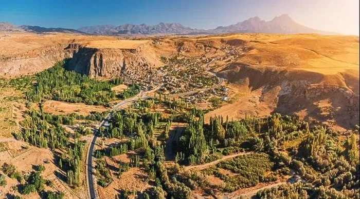 Framed Print : Aerial view of a village on a highland plateau in Cappadocia, with Hasandag volcano mountain in the background Framed Print : Aerial view of a village on a highland plateau in Cappadocia, with Hasandag volcano mountain in the background