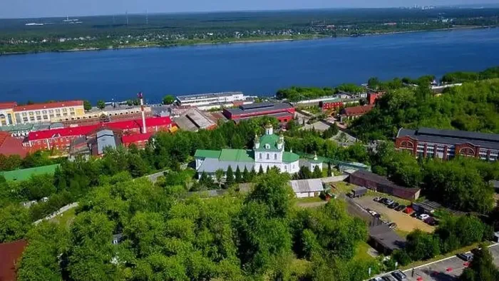 Framed Print : Aerial view of a village located by the river shore. Clip. Flying above summer green nature and buildings Framed Print : Aerial view of a village located by the river shore. Clip. Flying above summer green nature and buildings