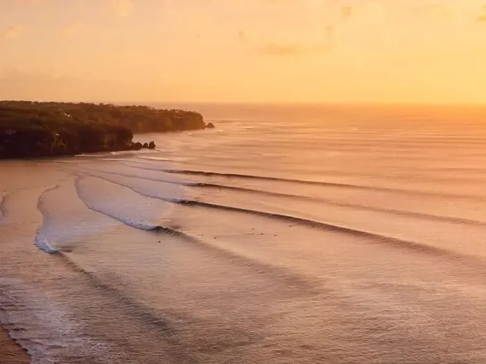Framed Print : Aerial view of warm sunset or sunrise and ocean with perfect long waves in Bali Framed Print : Aerial view of warm sunset or sunrise and ocean with perfect long waves in Bali