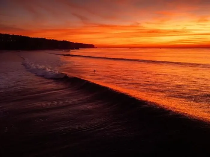 Framed Print : Aerial view of warm sunset or sunrise and ocean with silhouette of perfect waves in Bali