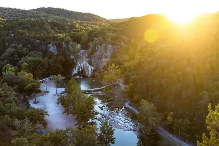 Framed Print : Aerial view of water cascading over rocks into a natural pool at Turner Falls in Oklahoma on sunset Framed Print : Aerial view of water cascading over rocks into a natural pool at Turner Falls in Oklahoma on sunset