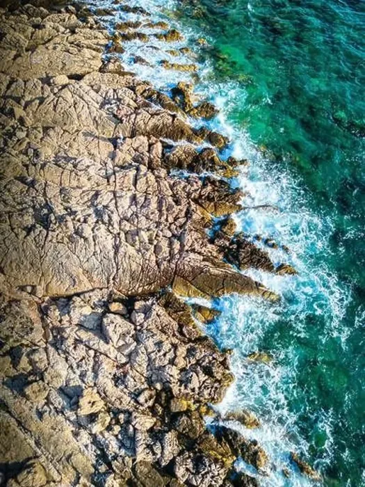 Framed Print : Aerial view of waves splashing the Punta Planka shore, with sharp rocks Framed Print : Aerial view of waves splashing the Punta Planka shore, with sharp rocks