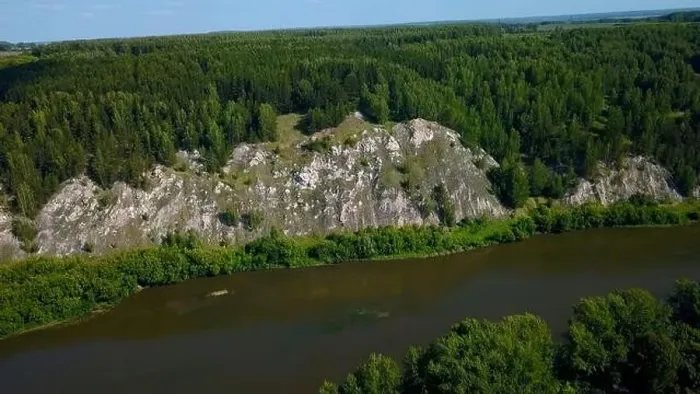 Framed Print : Aerial view of wild nature with rock clif and endless forest. Clip. Beautiful river along summer trees Framed Print : Aerial view of wild nature with rock clif and endless forest. Clip. Beautiful river along summer trees