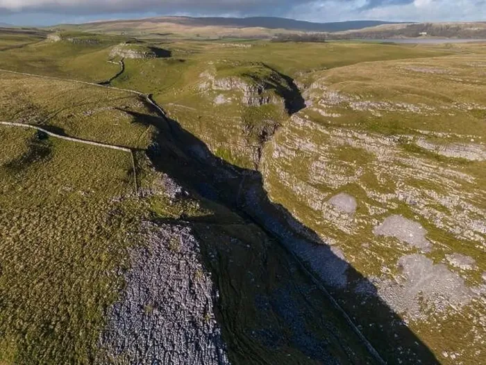 Framed Print : Aerial views of Limestone Pavement near Malham with Comb Hill and Dean Moor Hill in the distance Framed Print : Aerial views of Limestone Pavement near Malham with Comb Hill and Dean Moor Hill in the distance