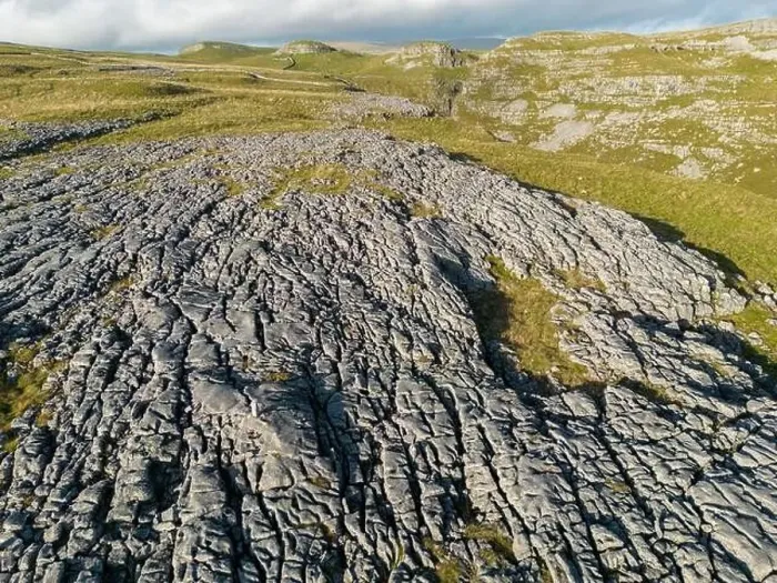 Framed Print : Aerial views of Limestone Pavement near Malham with Comb Hill and Dean Moor Hill in the distance Framed Print : Aerial views of Limestone Pavement near Malham with Comb Hill and Dean Moor Hill in the distance