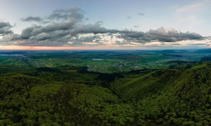 Framed Print : Aerial wide panoramic view of dark mountain hills covered with green mixed pine and lush forest in evening Framed Print : Aerial wide panoramic view of dark mountain hills covered with green mixed pine and lush forest in evening
