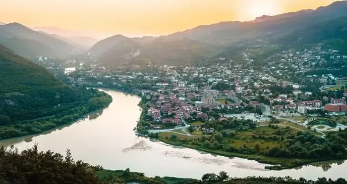 Framed Print : Aerial wide view historical former Georgia capital Mtskheta city with valley and river background Framed Print : Aerial wide view historical former Georgia capital Mtskheta city with valley and river background