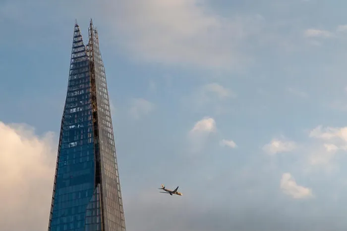 Framed Print : An aeroplane flies past the Shard on a sunny evening Framed Print : An aeroplane flies past the Shard on a sunny evening