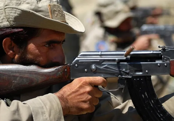 Framed Print : An Afghan security guard, assigned to Forward Operating Base Torkham, fires an AK-47 assault rifle during a weapons range hosted by the 527th Framed Print : An Afghan security guard, assigned to Forward Operating Base Torkham, fires an AK-47 assault rifle during a weapons range hosted by the 527th