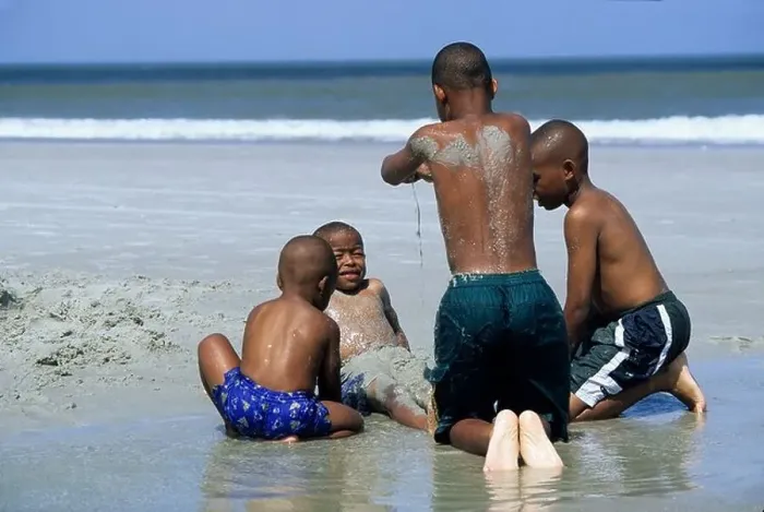 Framed Print : African American boys playing in sand at beach Jacksonville Florida Framed Print : African American boys playing in sand at beach Jacksonville Florida