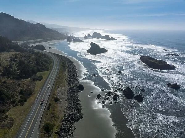 Afternoon sunlight shines on the scenic southern coast of Oregon. This rugged region is found in the Samuel H. Boardman State Scenic Corridor