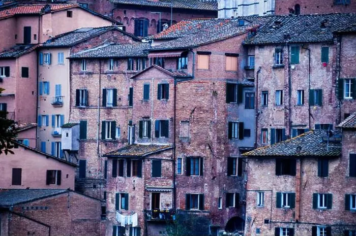 Framed Print : Aged red brick townhouses in medieval Siena, Italy Framed Print : Aged red brick townhouses in medieval Siena, Italy