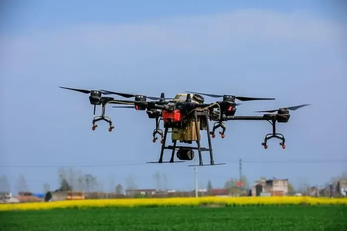 Framed Print : Agricultural drone spraying pesticides. Drones are used in agriculture Framed Print : Agricultural drone spraying pesticides. Drones are used in agriculture