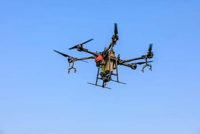 Framed Print : Agricultural drone spraying pesticides. Drones are used in agriculture Framed Print : Agricultural drone spraying pesticides. Drones are used in agriculture