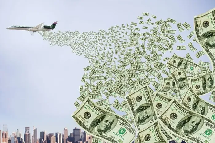 Framed Print : Airplane dropping money over city Framed Print : Airplane dropping money over city