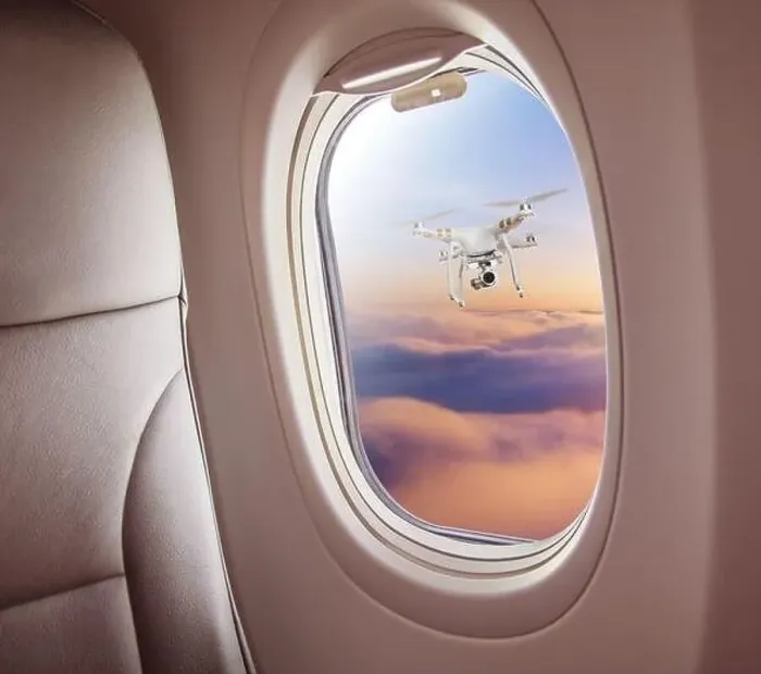Framed Print : Airplane interior with window view of drone flying nearby. Concept of travel, air transportation and danger of collision Framed Print : Airplane interior with window view of drone flying nearby. Concept of travel, air transportation and danger of collision