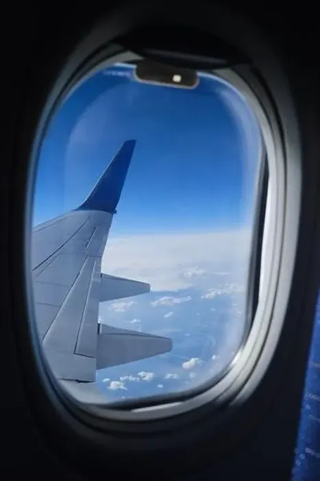 Framed Print : Airplane window view on the clouds and blue sky horizon. Plane wing vertical view in porthole Framed Print : Airplane window view on the clouds and blue sky horizon. Plane wing vertical view in porthole