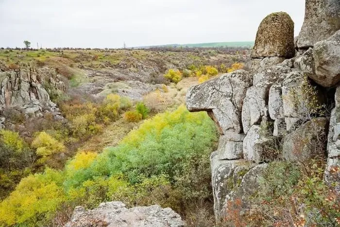 Framed Print : Aktovsky Canyon, Ukraine. Autumn trees and large stone boulders around Framed Print : Aktovsky Canyon, Ukraine. Autumn trees and large stone boulders around