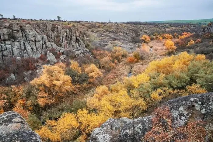 Framed Print : Aktovsky Canyon, Ukraine. Autumn trees and large stone boulders around