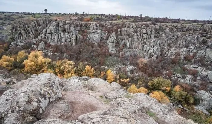 Framed Print : Aktovsky Canyon, Ukraine. Autumn trees and large stone boulders around